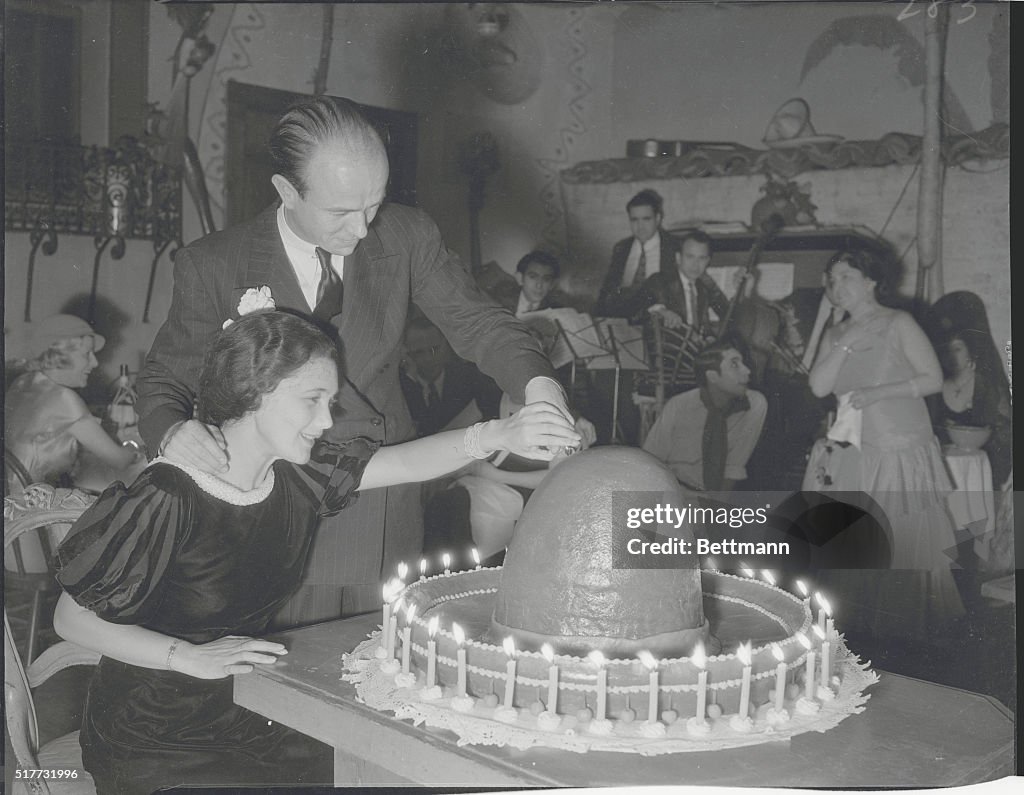 Couple Cutting Sombrero Cake
