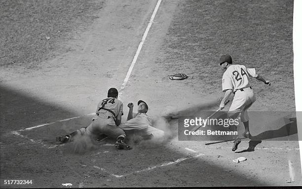 Pete Reiser, center fielder for the Brooklyn Dodgers, as he scored safely on a hit by Dodger first baseman Dolph Camilli in the first inning of the...