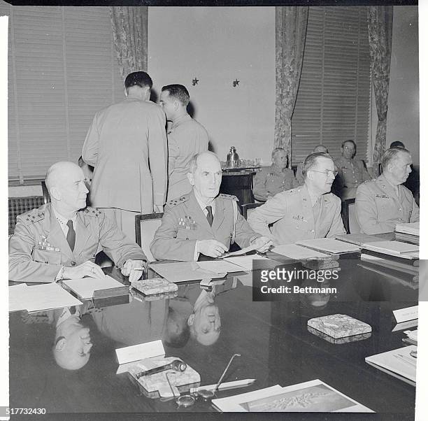 At a meeting of the Joint and Combined Chiefs of Staff, consisting of high American and British war strategists, four American leaders weigh a...