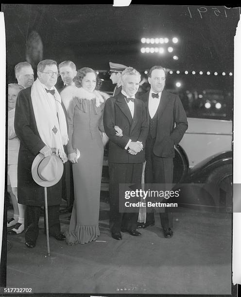 Los Angeles, California: Charles Chaplin and party at the premier of The Bowery in Los Angeles. In the group left to right are Rupert Hughes, Pauline...