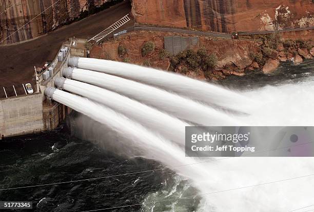 Water flows from the bypass tubes of Glen Canyon Dam at a rate of approximately 32,000 cubic feet per second November 21, 2004 in Page, Arizona. The...
