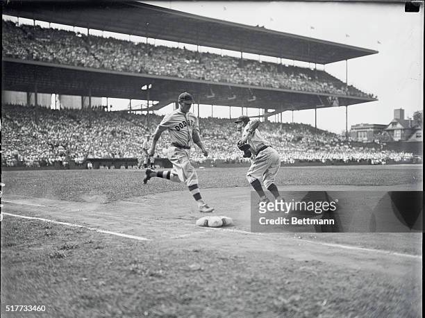 Chicago: Third baseman Joe Stripp of the Brooklyn Dodgers out at first base in the first inning of the third game of the three-game series between...