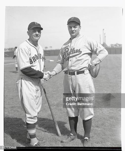 Casey Stengel, mentor of the Brooklyn Dodgers, and Jimmy Wilson, , Manager of the Phillies, shake hands before their teams met in their first...