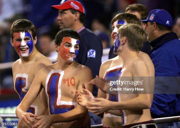 Fans of quarterback Eli Manning of the New York Giants attend the game against the Atlanta Falcons at Giants Stadium on November 21, 2004 in East...
