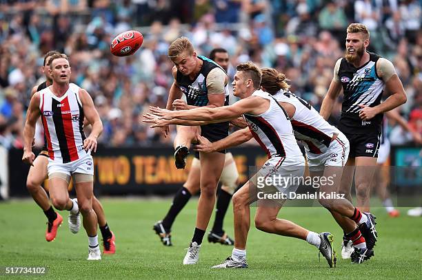 Ollie Wines of the Power gets a kick away during the round one AFL match between the Port Adelaide Power and the St Kilda Saints at Adelaide Oval on...