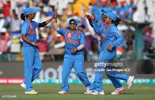 Harmanpreet Kaur of India celebrates her four wicket haul with team mates during the Women's ICC World Twenty20 India 2016 match between West Indies...