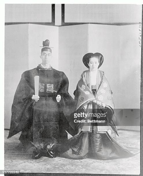 Time honored gowns and time honored pose - H.I.H. Prince Mikasa, youngest brother of the Emperor of Japan, and his bride, H.I.H. Princess Mikasa, the...
