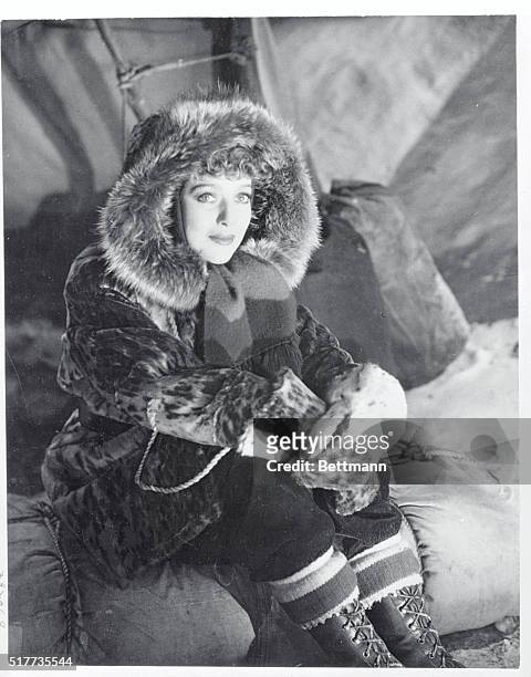 Loretta Young, feminine star of the Alaska gold rush picture, Call of the Wild, is pictured all dressed up for an outdoor sequence of the picture....