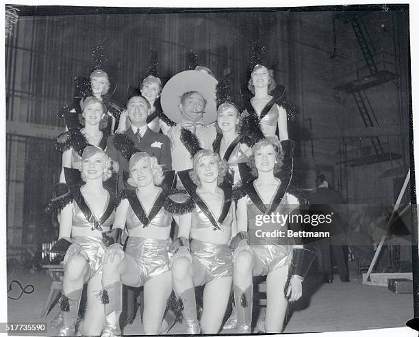 Benny Rubin and Leo Carrillo surrounded by chorus girls at the "All Star Show of 1935," given in Los Angeles to help raise funds for incurable...