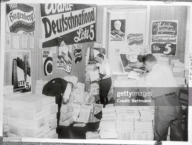 Scene in the headquarters of the Deutsch Nationale or Conservative party of Germany, showing workers preparing posters which will be distributed...