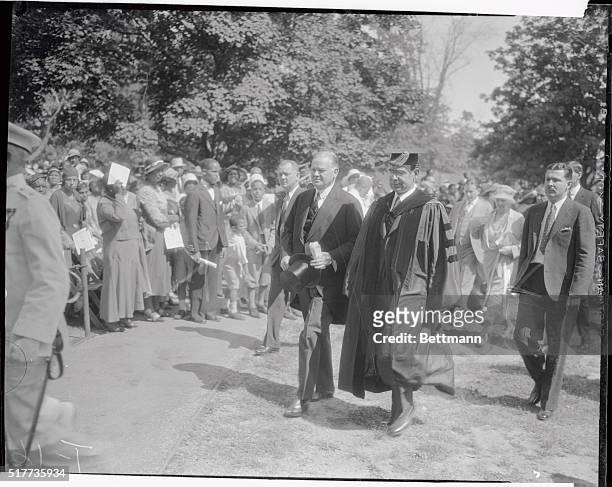 American politician US President Herbert Hoover and Howard University president Dr Mordecai Wyatt Johnson walk together after the university's...