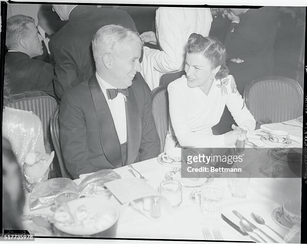 Beverly Wilshire Hotel: British and RAF War Relief Party given by Mrs. Basil Rathbone. Picture shows Charles Chaplin and Carman Figueroa attending...
