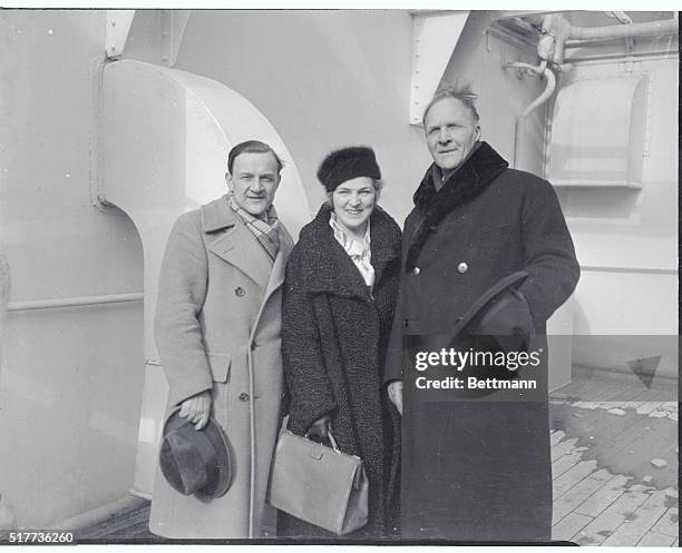 Feodor Chaliapin, famous Russian singer, Mme. Chaliapin, and their son, Boris Chaliapin , are pictured as they returned to New York on the S.S. Ile...
