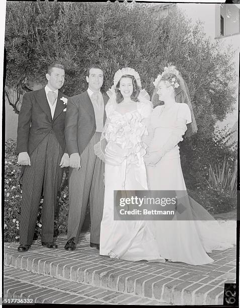 Actor Bruce Cabot, best man; Mr. And Mrs. Pasquale 'Pat' DiCicco and Shirley Cowan, maid of Honor, pose for cameramen after marriage of the actor's...