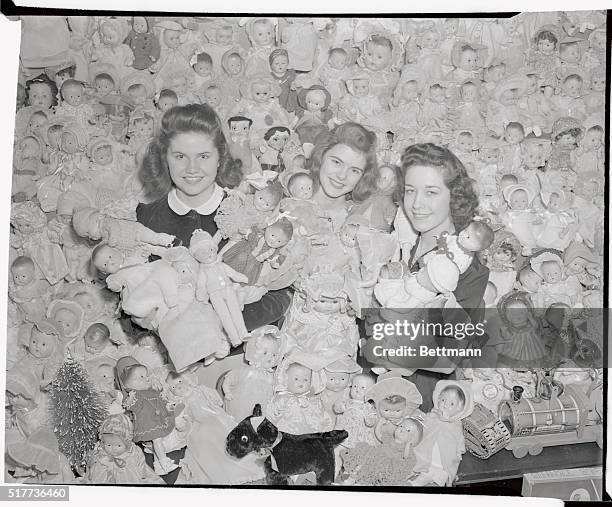 Twenty five years ago when two girls, young telephone women got together with several friends and sent a barrel of dolls and toys to a Brooklyn...