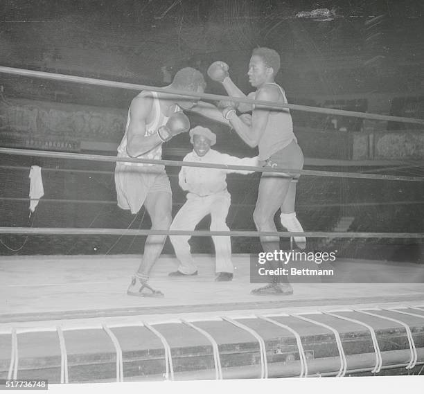 Here is boxing's strangest match. The opponents have but one leg apiece and the referee has but one arm. Jack "Roughhouse" Fletcher, 148 pounds, and...