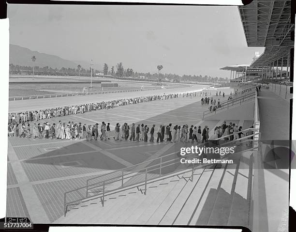 The layout on "Life In Japanita," at the Santa Anita Race Track of Arcadia, California, is shown. Always welcomed is the summons to dinner. Here is...