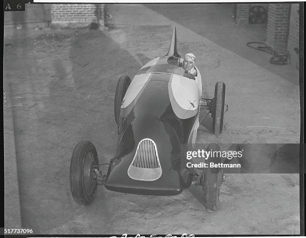 Will it Set New Mile and Kilometer Records? Los Angeles, Calif.: This strange-looking racing car resembling a prehistoric monster on wheels, has just...