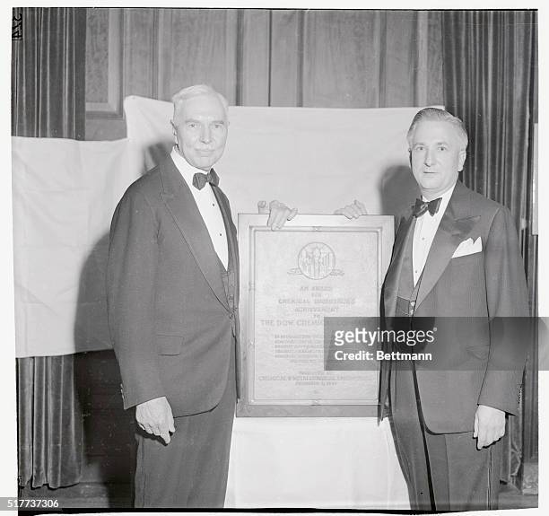 Dr. Willard H. Dow, President and Chairman of the the Board, the Dow Chemical Company, receives, on behalf of his company, from Colonel Alfred H....