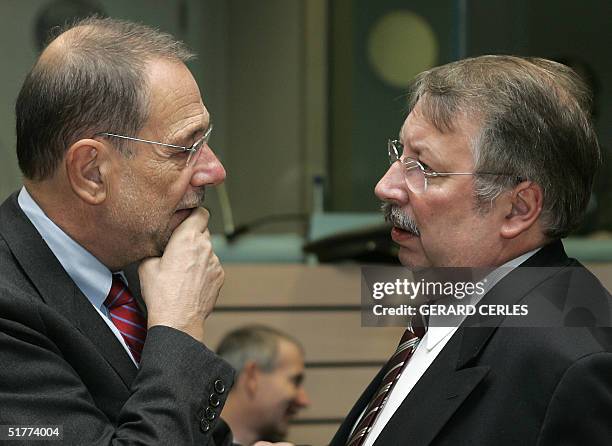 Foreign Policy chief Javier Solana of Spain chats with Belgian Defense Minister Andre Flahaut 22 November 2004 before an EU Defense Ministers Council...