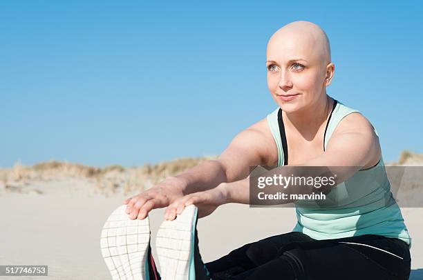 young woman with bald head doing sports - shaved head stock pictures, royalty-free photos & images
