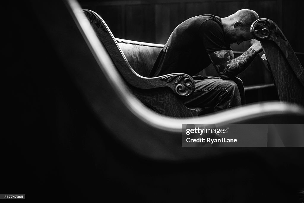 Man Praying in Church