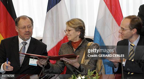 French Defence Minister Michele Alliot-Marie , her German counterpart Walter Kolbow and Luxembourg counterpart Luc Frieden sign the official act for...