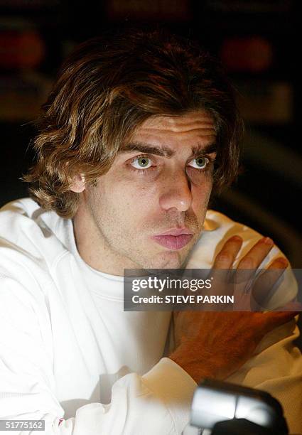 Olympique Lyon player Juninho Pernambucano speaks during a press conference in Manchester, England, 22 November, 2004. Olympique Lyon will play...