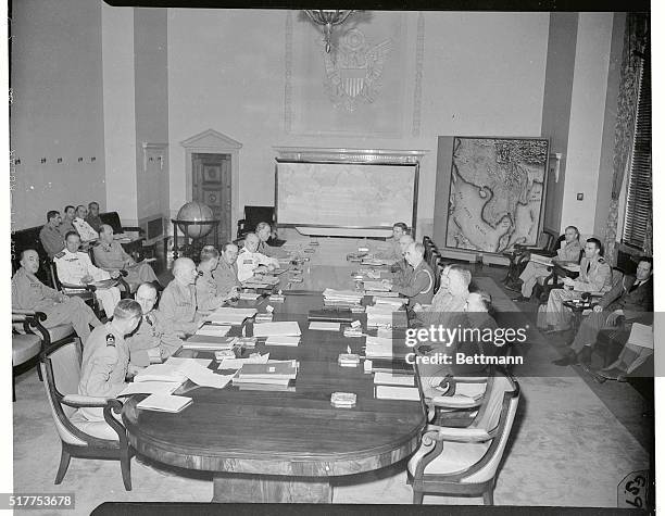 With American members on the left and British members on the right, the Joint and combined Chiefs of Staff hold session. Americans are : Lt.Gen. J.T....