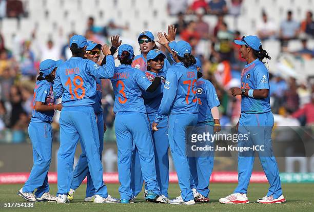 Harmanpreet Kaur of India celebrates her four wicket haul with team mates during the Women's ICC World Twenty20 India 2016 match between West Indies...