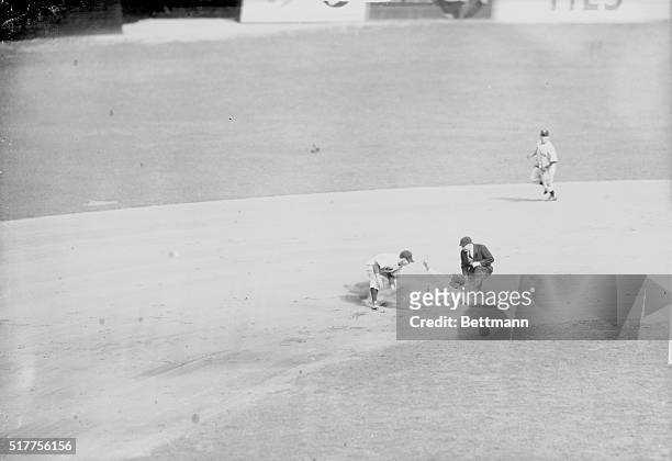 Brooklyn: Pete Reiser, Dodger center fielder, who had walked, is out at second base, on catcher Sherman Loller's peg to Phil Rizzuto, short stop. The...