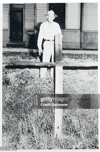 Cross Burned During Trial. Sumner, Mississippi: Marshal L.E. McNeer stands behind a crude wooden cross he found burning in Sumner, Miss., site of the...