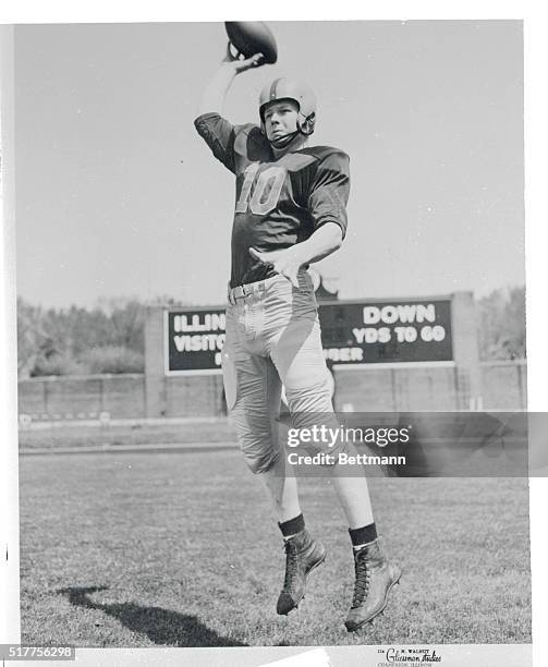 Tackled Sized Quarterback. Champaign, Illinois: Hiles Stout, quarterback for the Illinois football eleven, gets off a jump pass during a workout at...