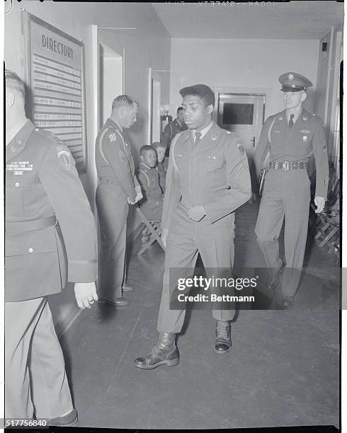 On his way to the court room is PFC, Thomas L. Devore, a member of Company M, 6th Infantry Regiment, stationed in Berlin, of Brooklyn, N.Y. A Berlin...