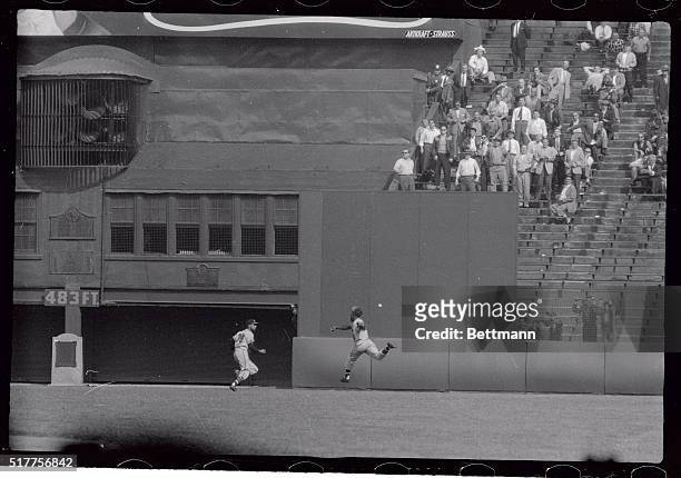 Braves Right fielder Henry Aaron almost loses his cap as he makes a frantic leaping lunge at the ball hit by Willie Mays in the 9th inning of the...