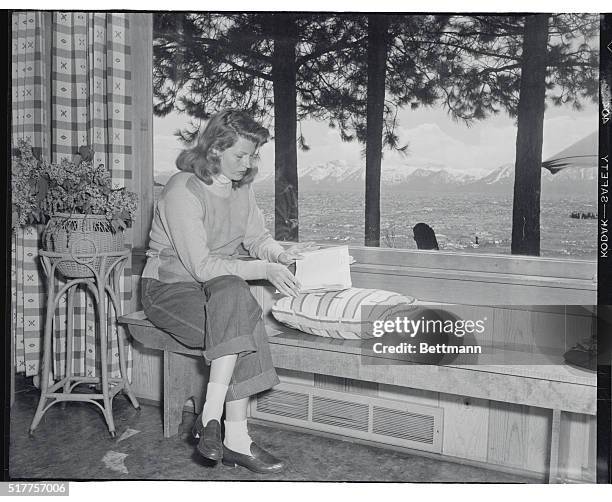 Rita is Fit to Be Untied. Lake Tahoe, Nevada: Rita Hayworth who is weary of being Princess Aly Khan, is shown in the living room of her Lake Tahoe...