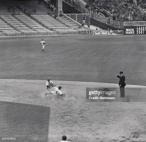 Mickey Mantle, slugging outfielder for the New York Yankees is forced out at second base when Coleman hit into a double play. The ball went from...