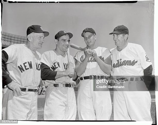 Casey Stengel and Yogi Berra of the Yankees pose with Al Rosen and Al Lopez of the Cleveland Indians .