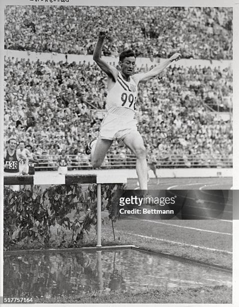 Horace Ashenfelter, 29 year old FBI man, is shown winning his heat in the Olympics 3,000 Meter Steppelchase. He broke the record in doing it. Today...