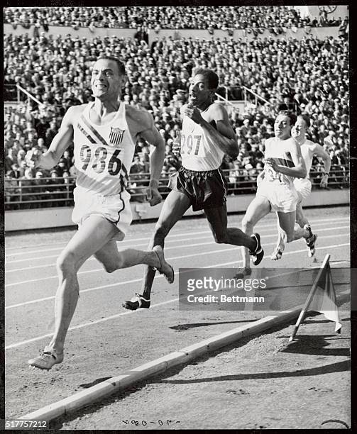 Whitfield leads A.S. Wint in the last 100 yards dash, to win the 800 meters. Final at the Olympic stad., Helsinki.