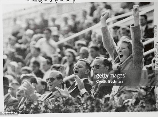 Helsinki, Finland: ...For Holland. Princess Beatrix of the Netherlands leaps for joy as Holland scores a goal during the July 30th Olympic water Polo...