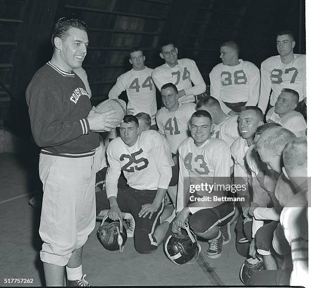 Otto Graham talks to members of the U.S. Coast Guard Academy Football team here March 2. Graham, former star quarterback with the Cleveland Browns,...