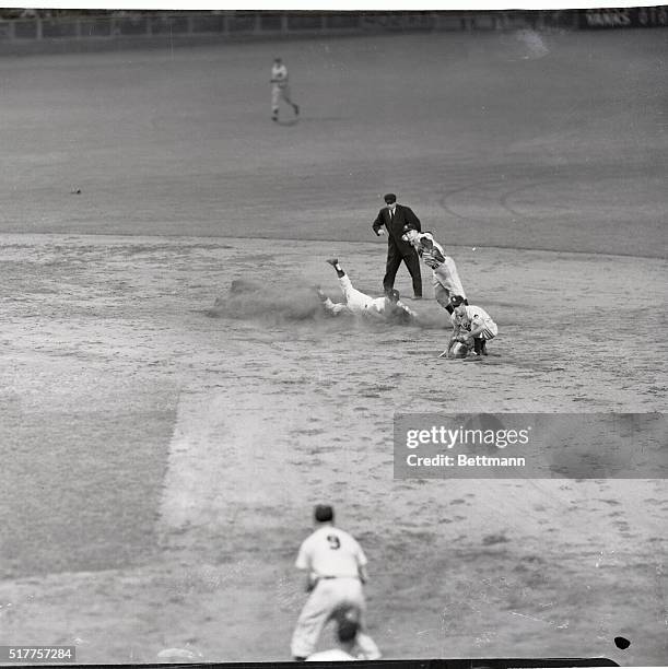 New York's Mickey Mantle is forced at second as ST. Louis shortstop Demaestri fires to first in unsuccessful attempt to nip Yank Joe Collins in 6th...