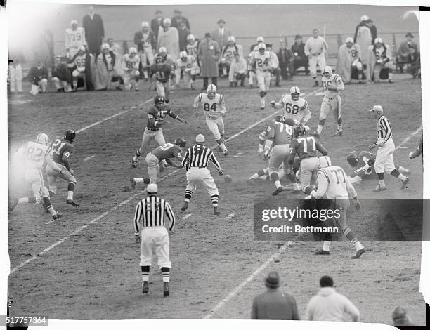 The New York Giants' Jim Patton is halfway to the turf and the ball as he pounces on a fumble by the Baltimore Colts' John Unitas during the 1958 NFL...