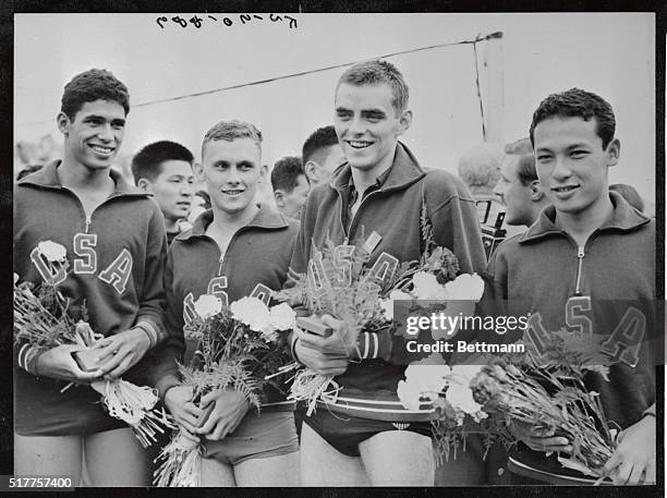 The four members of the United States 800 meter swimming relay team, who set a new Olympic record of 8 minutes, 31.1 seconds when they won their...