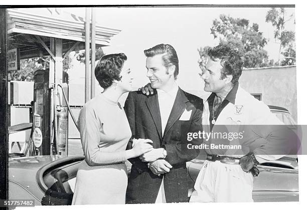 Actor Robert Wagner, returning to Hollywood from Mexico, introduces his "Mother," Katy Jurado, who played his mother in Broken Lance, to his father,...