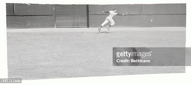 Giant centerfielder Willies Mays, charges across in time to make a spectacular one-handed catch of Carl Furillo's line drive to right center at...
