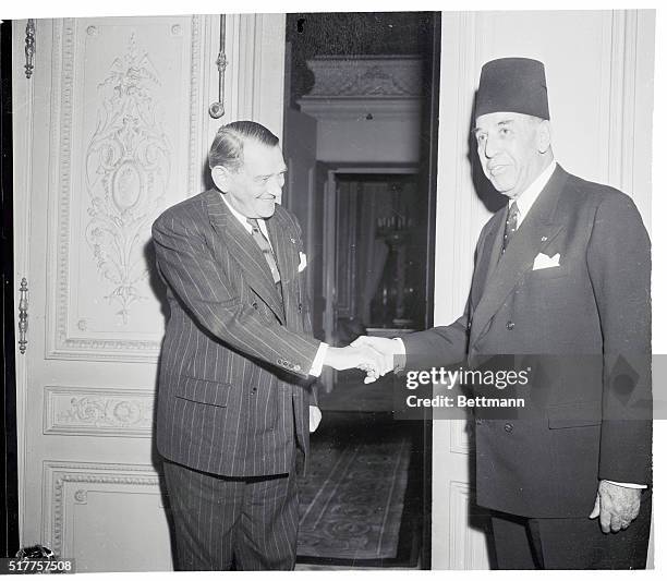 French President Rene Coty bids farewell to Tunisia's Premier Tahar Ammar. The Tunisian Statesman visited Paris to talk with French officials about...
