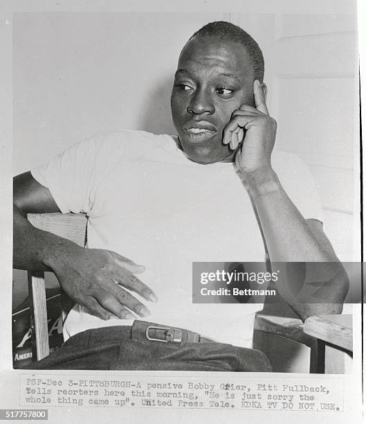 Bobby Grier, center of the controversy over the Georgia Tech-Pitt Sugar Bowl game, talks it over with reporters at the University of Pittsburgh, Pa....