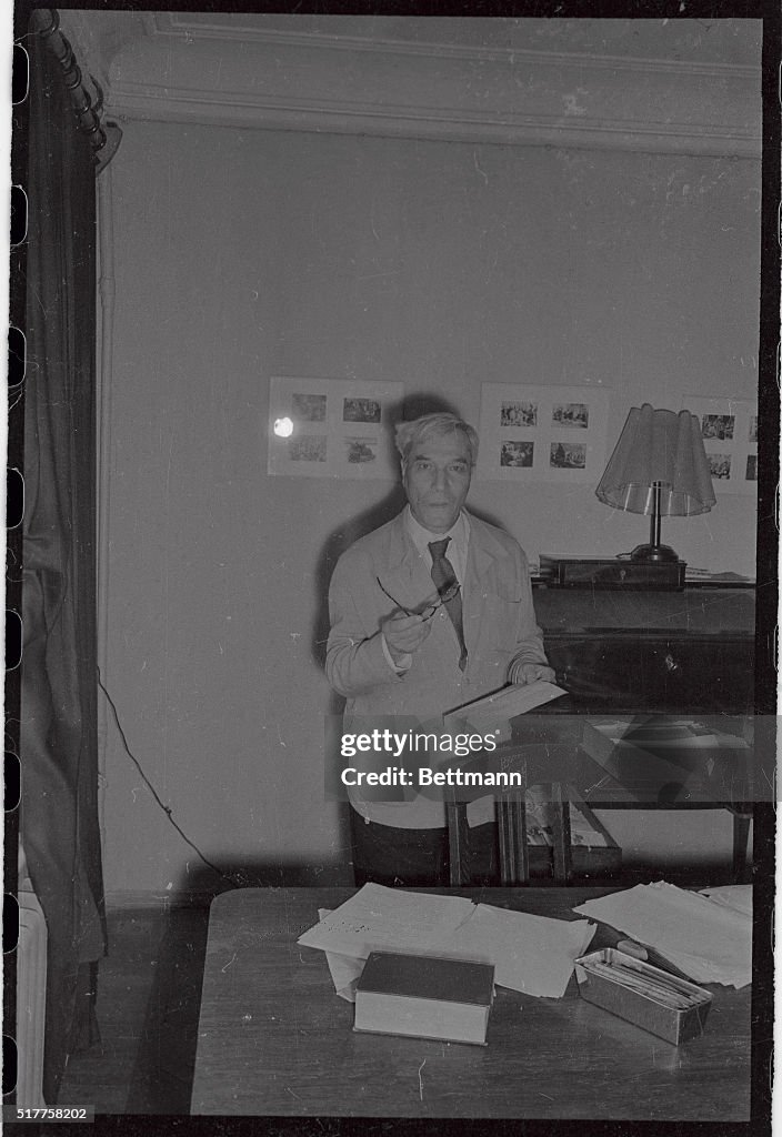 Boris Pasternak Holding Eyeglasses and Looking Towards Camera